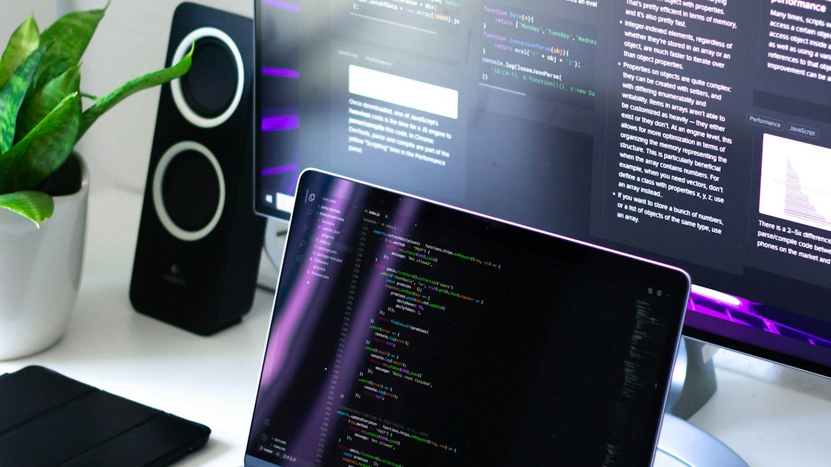 Developer workstation with code on screen, representing custom automation